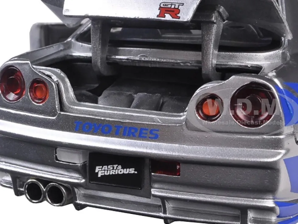 Brian's Nissan GTR Skyline R34 RHD (Right Hand Drive) Silver with Blue Stripes "Fast & Furious 25th Anniversary" Series 1/24 Diecast Model Car by Jada
