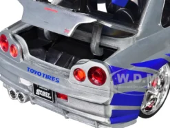 Brian's Nissan Skyline GT-R (R34) RHD (Right Hand Drive) Silver Color Brush Finish with Blue Stripes "2 Fast 2 Furious" (2003) Movie "Fast & Furious" Series 1/24 Diecast Model Car by Jada