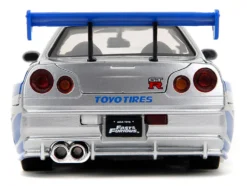 Brian's Nissan Skyline GT-R (R34) Silver Metallic with Blue Stripes and Suki's Honda S2000 Pink with Graphics Set of 2 Cars 