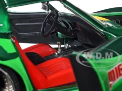 1969 Chevrolet Corvette Stingray ZL1 Green Metallic with Yellow Stripes and Cammy Diecast Figure Street Fighter Video Game Anime Hollywood Rides Series 1/24 Diecast Model Car Jada 30837