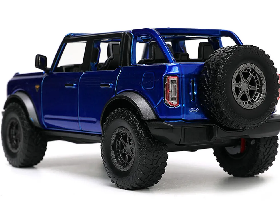 2021 Ford Bronco Open-Top Candy Blue Metallic with Extra Wheels "Just Trucks" Series 1/24 Diecast Model Car by Jada