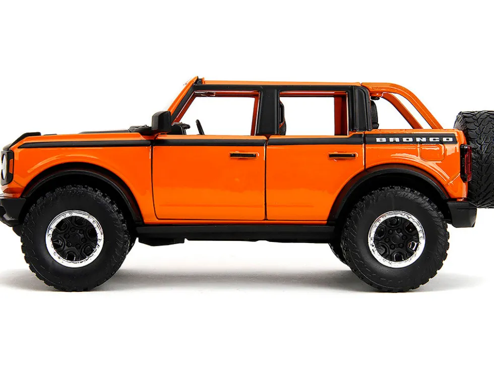 2021 Ford Bronco Open-Top Orange with Black Stripes and Hood with Extra Wheels "Just Trucks" Series 1/24 Diecast Model Car by Jada