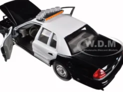 1999 Ford Crown Victoria Unmarked Police Car Black/White In Display Case with Light Bar and Push Bar 1/24 Diecast Model Car Welly SH2082S-BSW