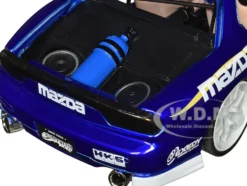 1993 Mazda RX-7 Candy Blue Metallic with Graphics and Chun-Li Diecast Figure Street Fighter Video Game Anime Hollywood Rides Series 1/24 Diecast Model Car Jada 30838