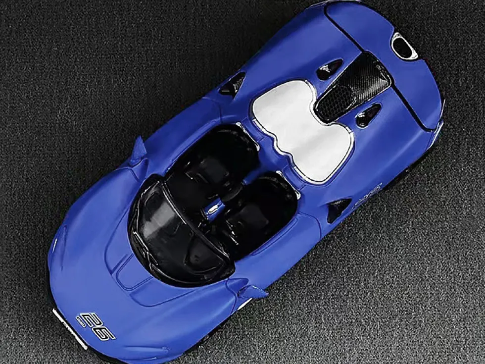 McLaren Elva Convertible #26 Matt Blue with White Stripes Extra Wheels 1/64 Diecast Model Car CM Models CM64-ELVA-01