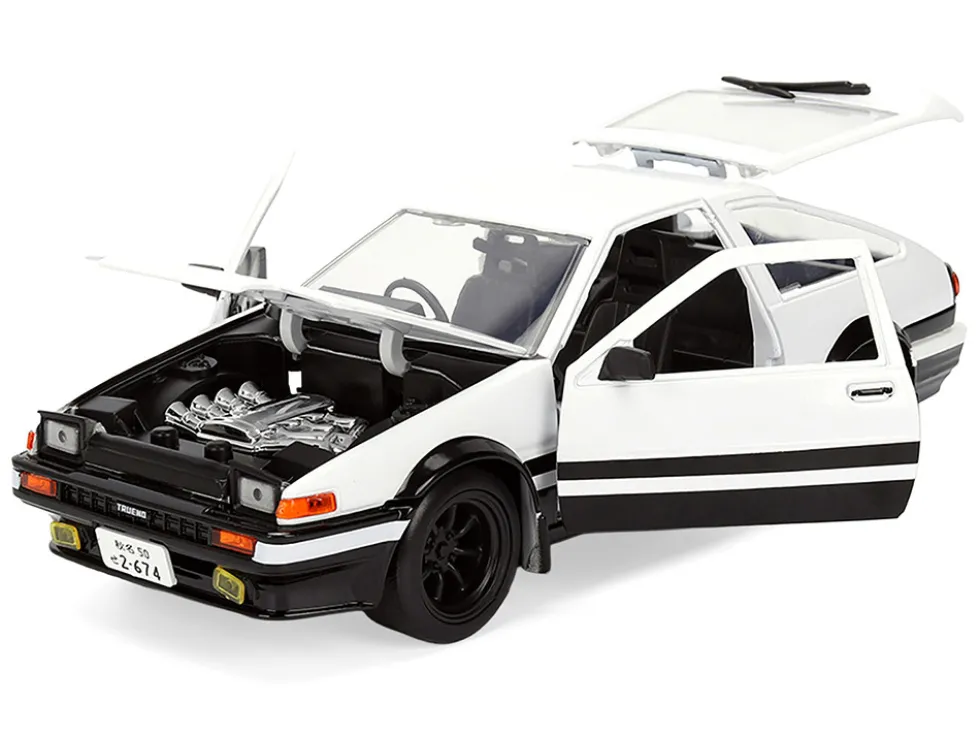 Toyota Trueno (AE86) RHD (Right Hand Drive) White and Black with Graphics and Takumi Diecast Figure "Initial D" (1998-2021) TV Series "Anime Hollywood Rides" Series 1/24 Diecast Model by Jada
