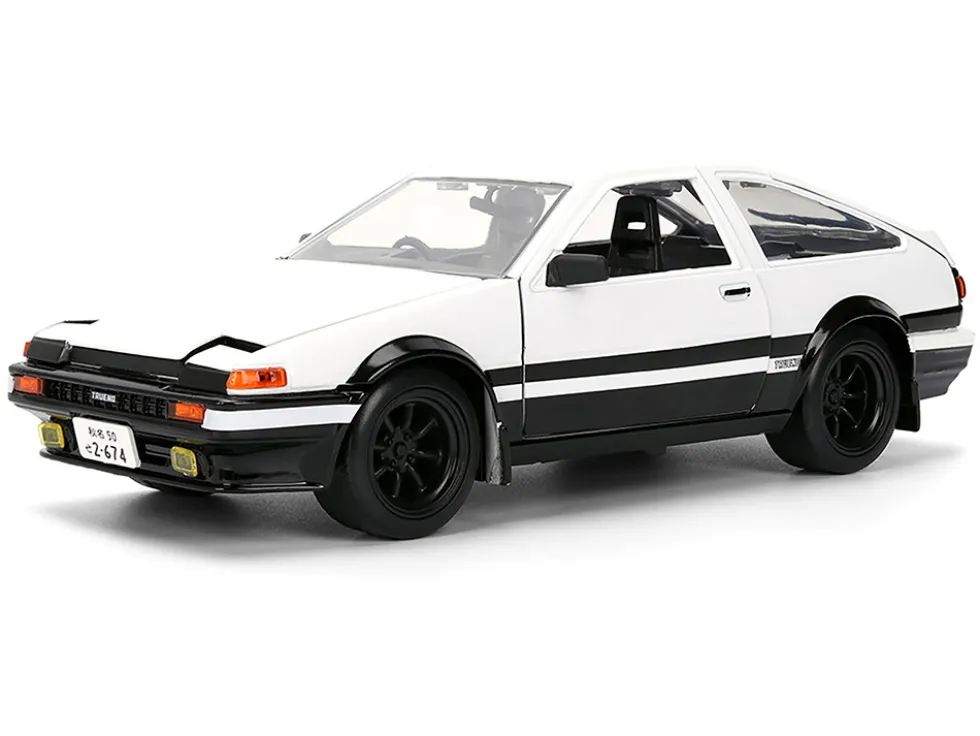 Toyota Trueno (AE86) RHD (Right Hand Drive) White and Black with Graphics and Takumi Diecast Figure "Initial D" (1998-2021) TV Series "Anime Hollywood Rides" Series 1/24 Diecast Model by Jada